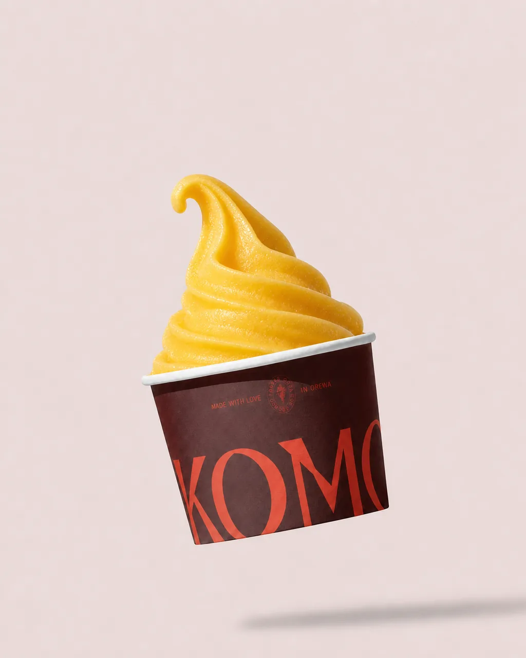 Komo Passionfruit base in a branded cup